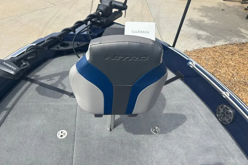 Slide: The Image of Nitro ZV21 Pro 2026 boat interior with Garmin equipment and cushioned seating. - 17