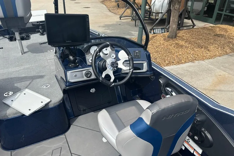 Slide: The Image of Interior of 2026 Nitro ZV21 Pro boat with steering wheel and Garmin display. - 15