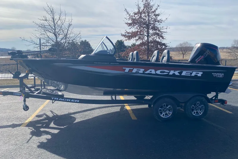 Slide: The Image of 2026 Tracker Targa V-19 Combo boat on trailer in parking lot. - 61