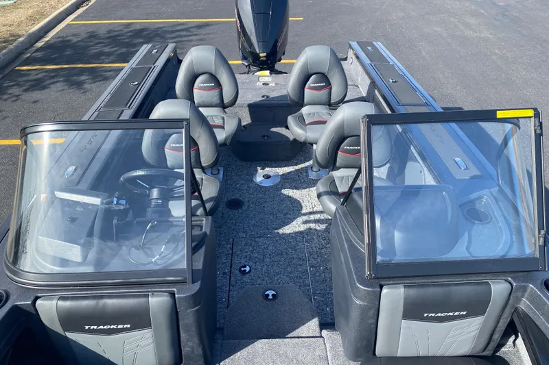 Slide: The Image of 2026 Tracker Targa V-19 Combo boat interior with seating and steering console. - 64