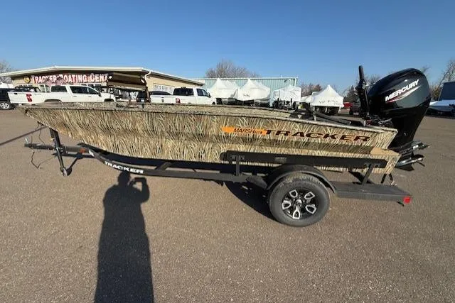 The Image of 2026 Tracker Grizzly 1756 T Marsh boat at Tracker Boating Center, featuring camo design and Mercury engine. - 0
