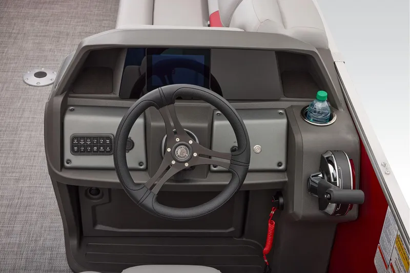 Slide: The Image of Manufacturer Provided Image: 2026 Sun Tracker Party Barge 22 DLX steering console with modern controls and cup holder. - 55