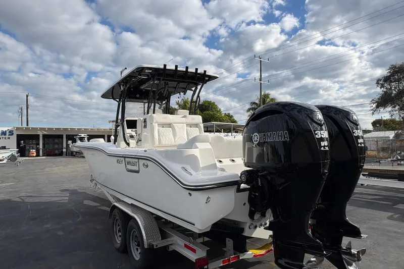 Slide: The Image of 2026 Key West 291 FS boat with dual Yamaha 350 engines on a trailer. - 2