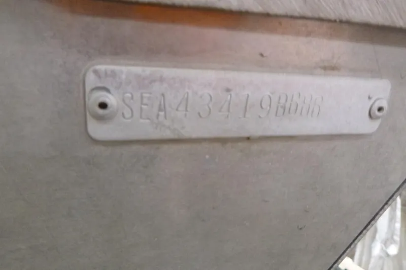 Slide: The Image of 1988 Sea Nymph TX170 boat hull identification number plate. - 12