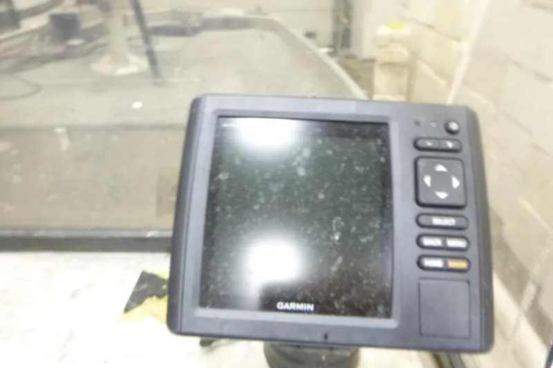 Slide: The Image of Garmin device on 1988 Sea Nymph TX170 boat dashboard, indoors. - 8