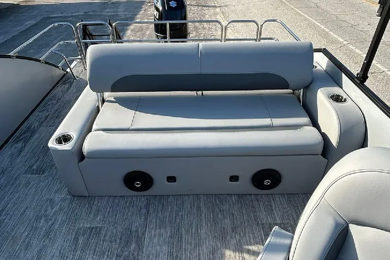 Slide: The Image of 2026 Bentley Pontoons Legacy 243 Swingback interior with gray seating and cup holders. - 10
