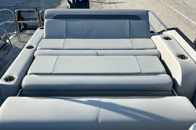 Slide: The Image of 2026 Bentley Pontoons Legacy 243 Swingback with luxurious seating and cup holders. - 14