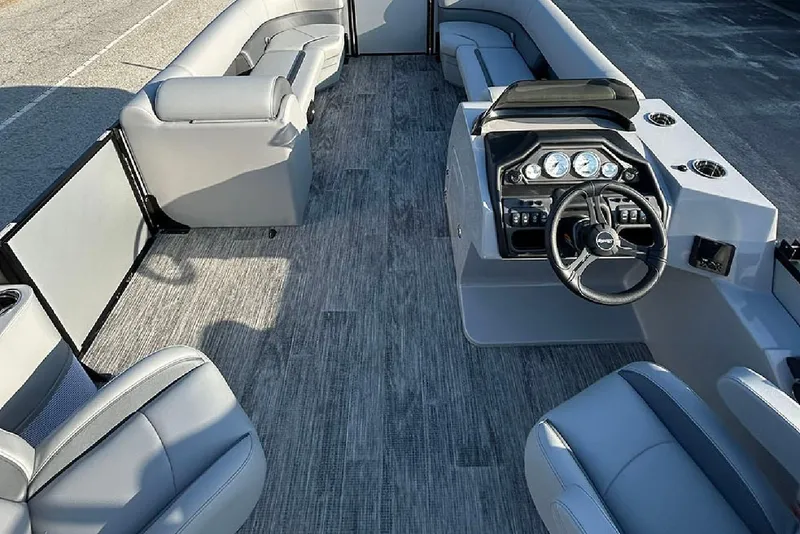Slide: The Image of 2026 Bentley Pontoons Legacy 243 Swingback interior with sleek seating and modern dashboard. - 15