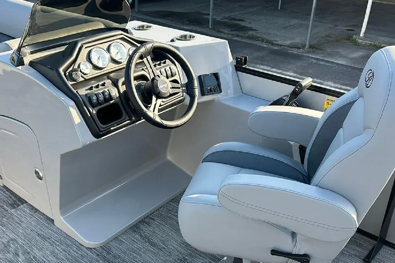 Slide: The Image of 2026 Bentley Pontoons Legacy 243 Swingback helm with steering wheel and captain's chair. - 16