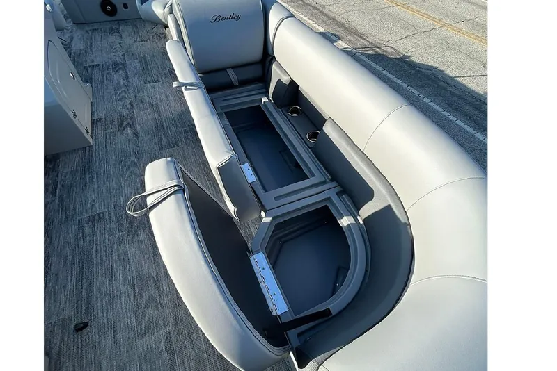 Slide: The Image of 2026 Bentley Pontoons Legacy 243 Swingback interior seating with storage compartments. - 19