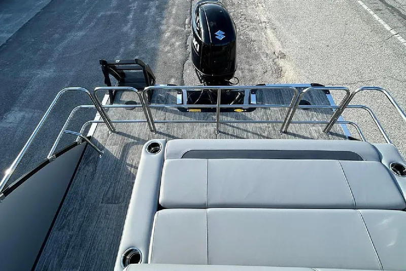 Slide: The Image of 2026 Bentley Pontoons Legacy 243 Swingback with Suzuki outboard motor, rear view. - 24