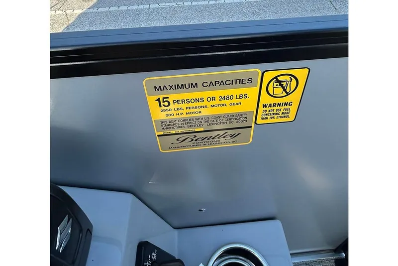 Slide: The Image of 2026 Bentley Pontoons Legacy 243 Swingback capacity label, 15 persons or 2480 lbs. - 26