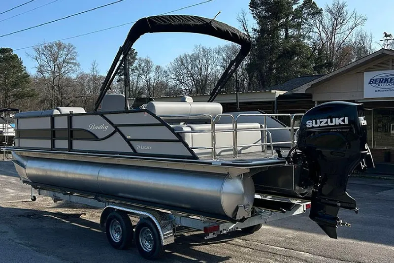 Slide: The Image of 2026 Bentley Pontoons Legacy 243 Swingback with Suzuki engine on trailer. - 5
