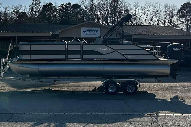 Slide: The Image of 2026 Bentley Pontoons Legacy 243 Swingback on trailer, parked outside dealership. - 6