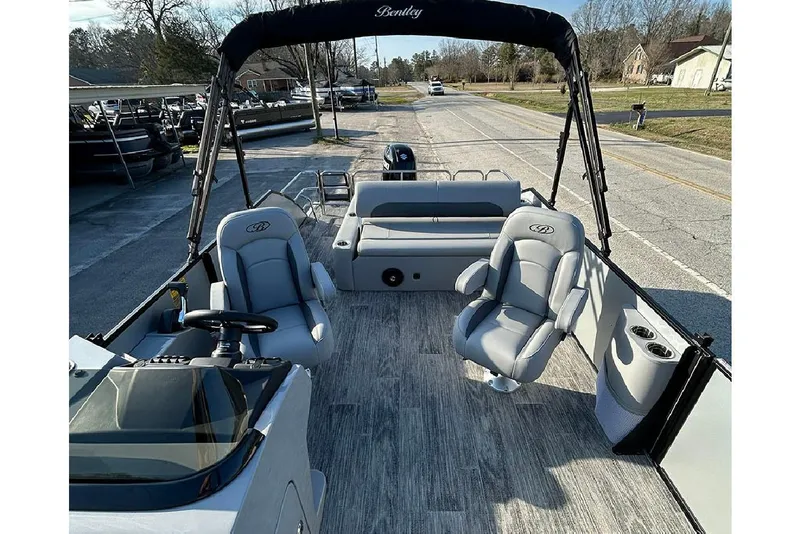 Slide: The Image of 2026 Bentley Pontoons Legacy 243 Swingback interior with seating and steering console. - 9