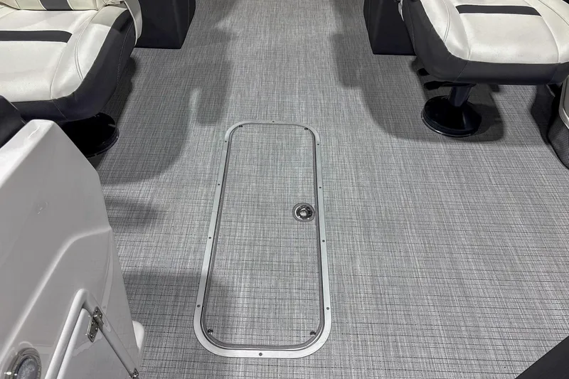 Slide: The Image of Interior of 2025 Trifecta 22RF CS boat with gray flooring and white seating. - 7