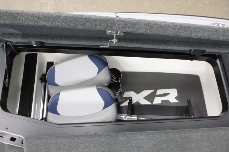 Slide: The Image of 2020 Skeeter FXR21 boat storage compartment with cushioned seats and FXR branding. - 11