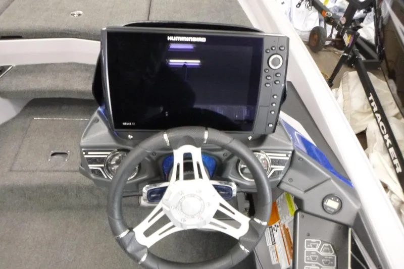 Slide: The Image of 2020 Skeeter FXR21 boat dashboard with Humminbird Helix 12 fishfinder and steering wheel. - 15