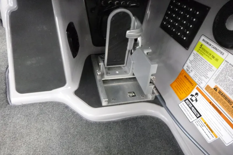 Slide: The Image of 2020 Skeeter FXR21 boat interior with foot pedal and safety warnings. - 16