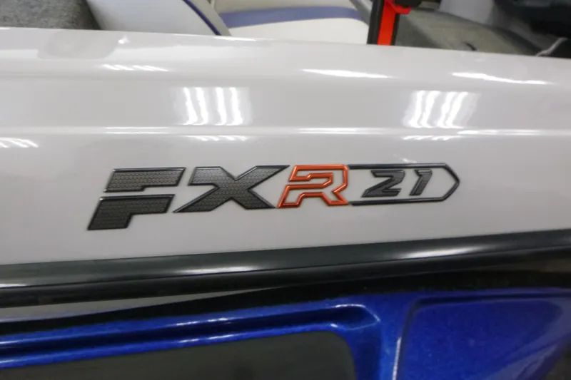 Slide: The Image of 2020 Skeeter FXR21 boat logo on white surface, close-up view. - 21