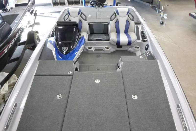 Slide: The Image of 2020 Skeeter FXR21 boat interior with dual seats and carpeted deck. - 5