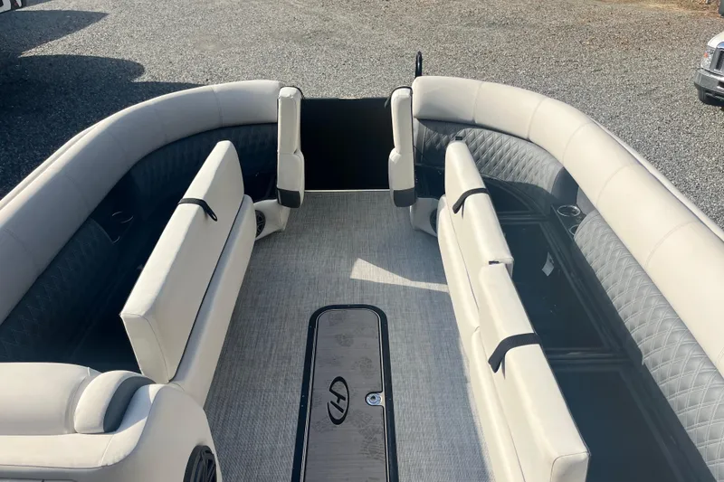Slide: The Image of 2023 Harris Cruiser Sunliner 250 interior with luxurious seating and modern design. - 7