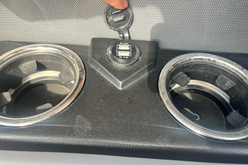 Slide: The Image of Cup holders and USB ports in 2023 Harris Cruiser Sunliner 250 boat interior. - 8