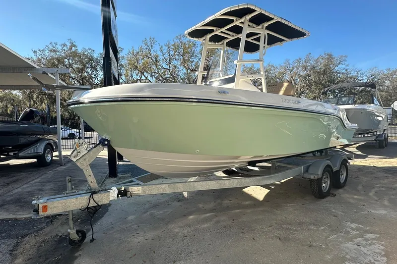 Slide: The Image of 2026 Bayliner Trophy T20CC boat on trailer, displayed outdoors. - 1