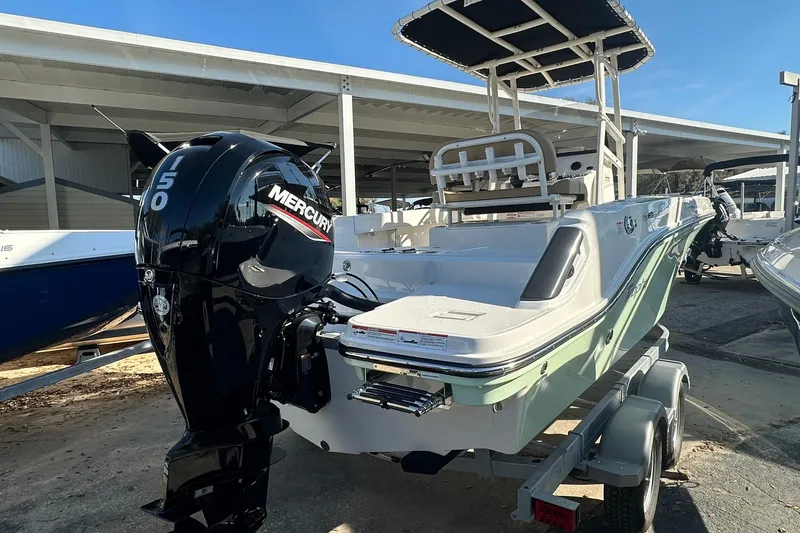 Slide: The Image of 2026 Bayliner Trophy T20CC boat with Mercury 150 engine on trailer. - 12
