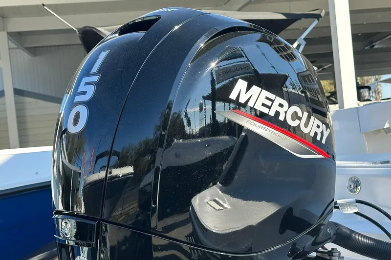 Slide: The Image of Mercury 150 outboard engine on 2026 Bayliner Trophy T20CC boat, reflecting surroundings. - 14