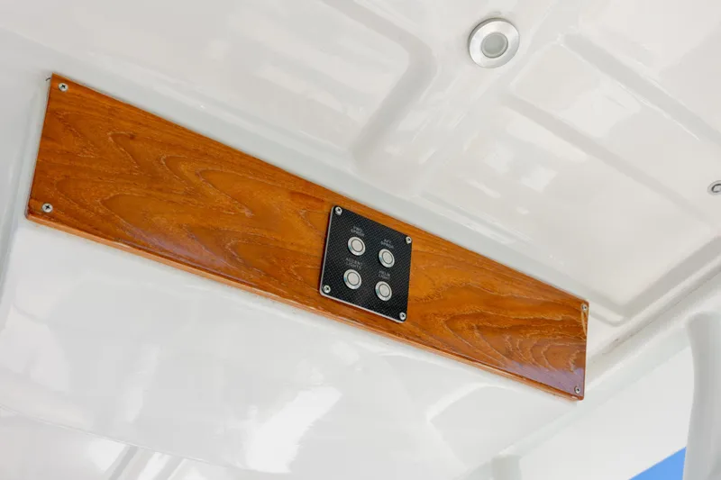 Slide: The Image of Wooden panel with controls on 2022 Vanquish Bristol Harbor 23 CC boat ceiling. - 27
