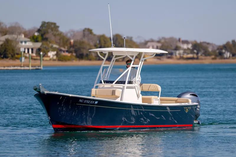 Slide: The Image of 2022 Vanquish Bristol Harbor 23 CC boat cruising on a calm lake. - 3
