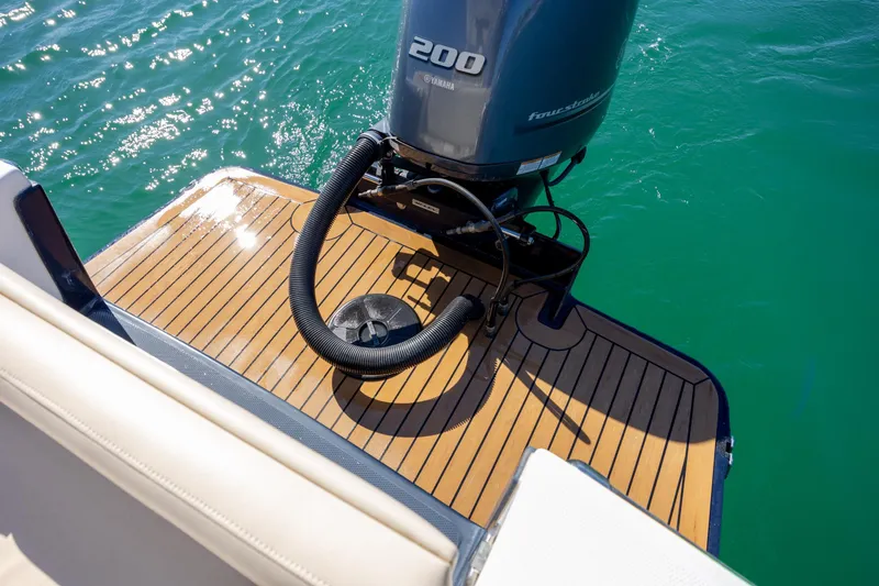 Slide: The Image of 2022 Vanquish Bristol Harbor 23 CC boat with Yamaha 200 engine on teak deck. - 9