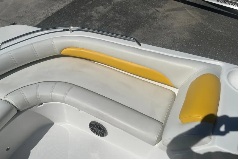 Slide: The Image of 2017 Godfey Hurricane SS 210 boat interior with yellow and gray seating. - 11