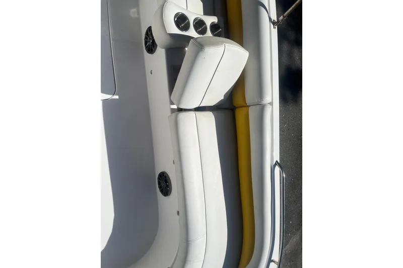 Slide: The Image of 2017 Godfey Hurricane SS 210 boat interior with white and yellow seating. - 13