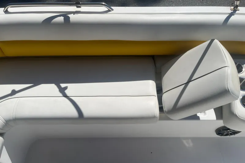 Slide: The Image of 2017 Godfey Hurricane SS 210 boat interior with white and yellow seating. - 14