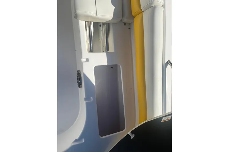 Slide: The Image of Interior view of a 2017 Godfey Hurricane SS 210 boat, featuring white and yellow seating. - 15