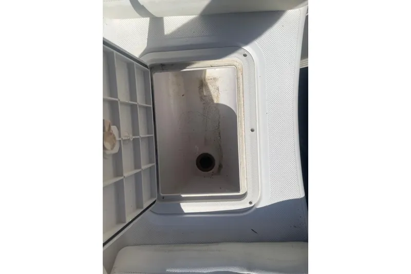 Slide: The Image of 2017 Godfey Hurricane SS 210 boat storage compartment, open and empty. - 19