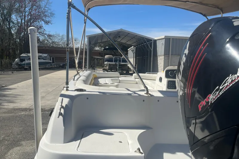 Slide: The Image of 2017 Godfey Hurricane SS 210 boat with Mercury engine, parked outdoors. - 20