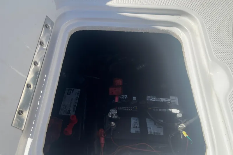 Slide: The Image of Battery compartment of 2017 Godfey Hurricane SS 210 boat, showing wiring and connections. - 22
