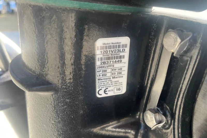 Slide: The Image of Label on Mercury Marine engine, showing model and serial numbers, attached to Godfey Hurricane SS 210. - 24