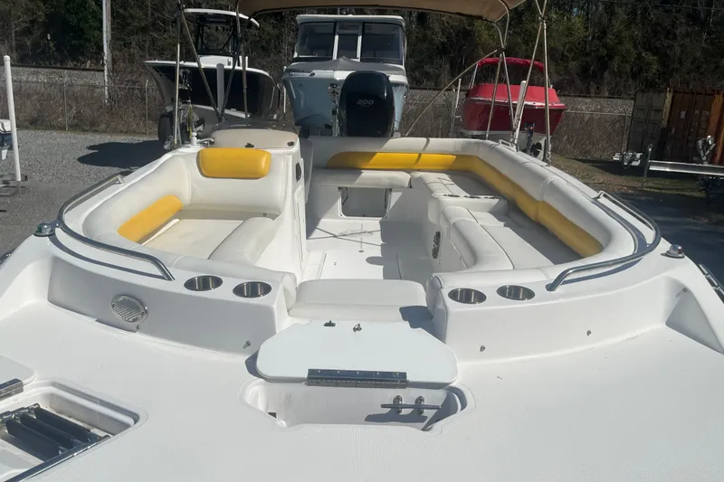 Slide: The Image of 2017 Godfey Hurricane SS 210 boat with spacious seating and yellow accents. - 6