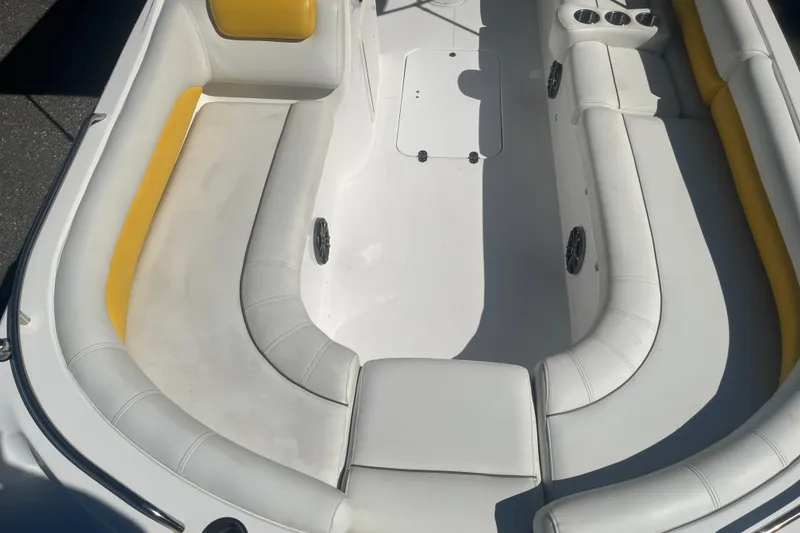 Slide: The Image of 2017 Godfey Hurricane SS 210 boat interior with white and yellow seating. - 7