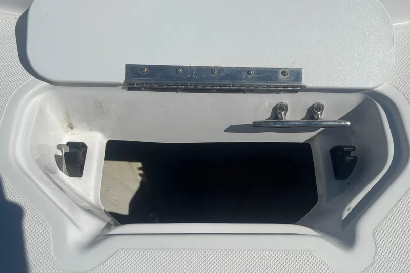 Slide: The Image of Open storage compartment on a 2017 Godfey Hurricane SS 210 boat. - 8