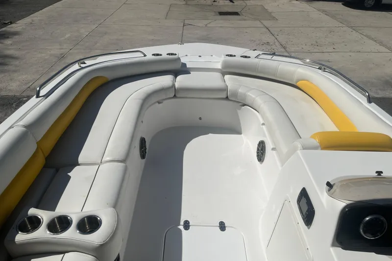 Slide: The Image of 2017 Godfey Hurricane SS 210 boat interior with white and yellow seating. - 9