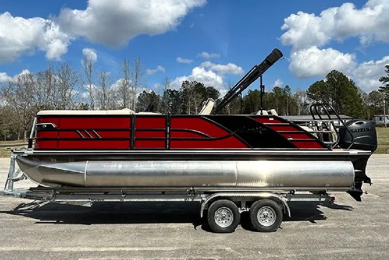 The Image of 2026 Bentley Pontoons 223 Elite Swingback DC on trailer under blue sky. - 0