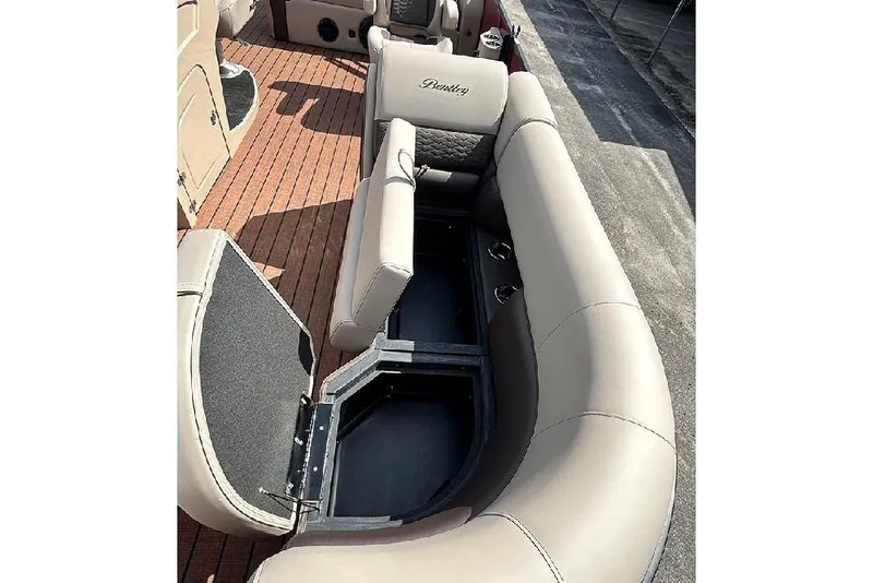 Slide: The Image of 2026 Bentley Pontoons 223 Elite Swingback DC interior with open storage compartment. - 10