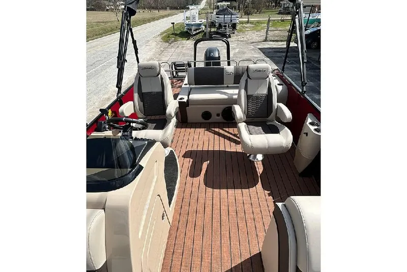 Slide: The Image of 2026 Bentley Pontoons 223 Elite Swingback DC interior with luxurious seating and wood-style flooring. - 13