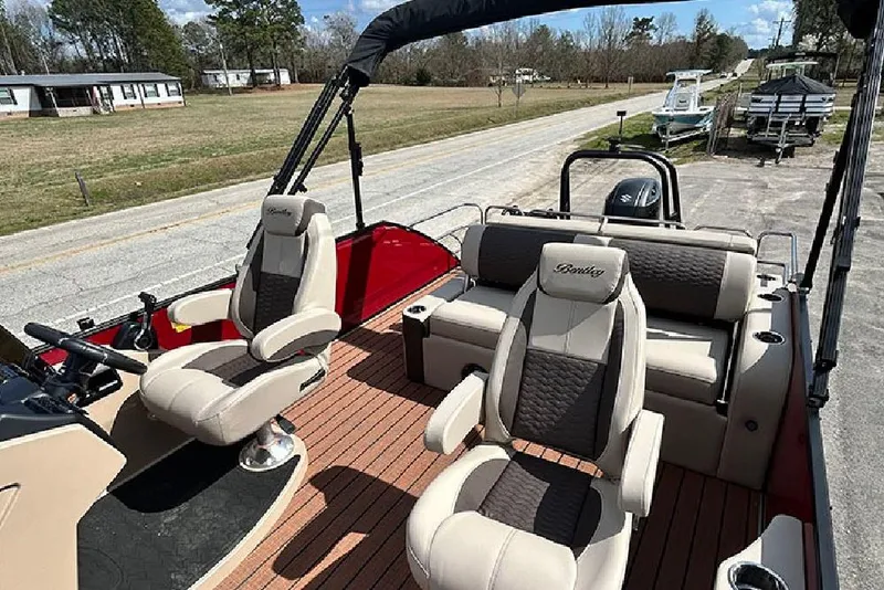 Slide: The Image of 2026 Bentley Pontoons 223 Elite Swingback DC with luxurious seating and modern design. - 26