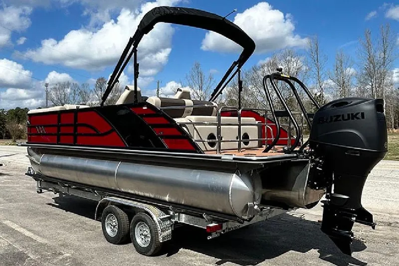 Slide: The Image of 2026 Bentley Pontoons 223 Elite Swingback DC on trailer, featuring Suzuki outboard motor. - 4